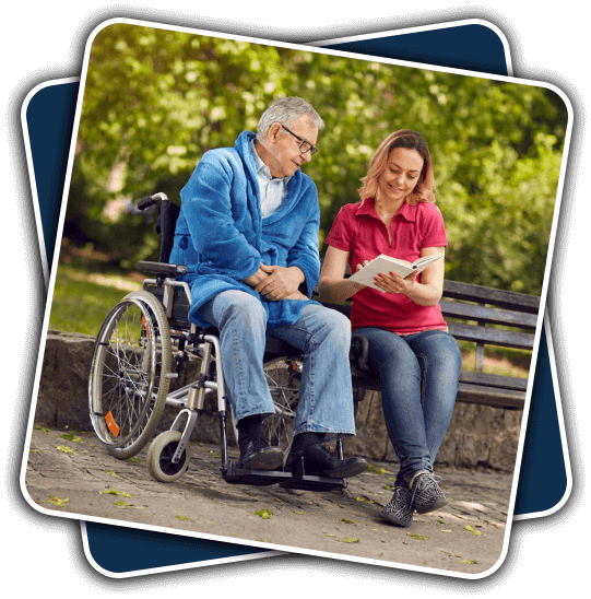 A man in a wheelchair and woman sitting on the bench